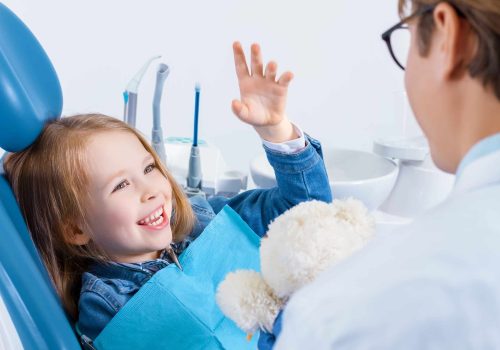 Little,Cute,Smiling,Girl,Is,Sitting,In,Dental,Chair,In